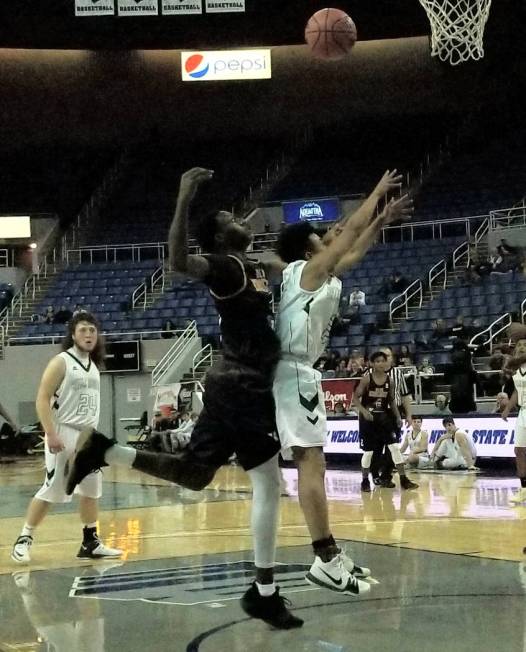 Democracy Prep’s Jared Holmes, left, and Battle Mountain’s Miles Piramide battle ...