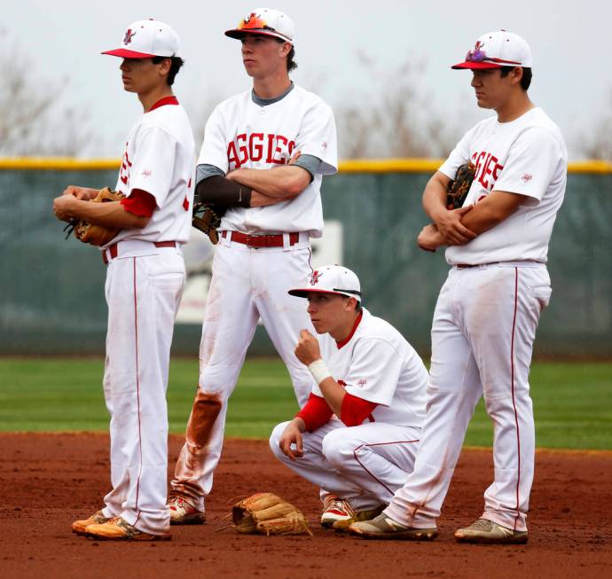 Arbor View Aggies wait at second base during a mound visit against the Rancho Rams at Desert ...