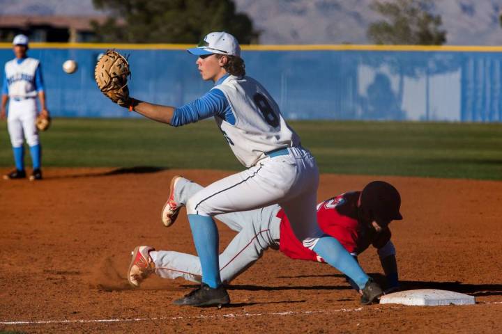 Centennial first baseman Adam Hazen looks to make a play while Arbor View’s Jesse Pier ...