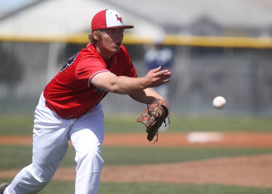 Las Vegas pitcher Brandon Culmo tosses to first base in the second inning of a baseball gam ...