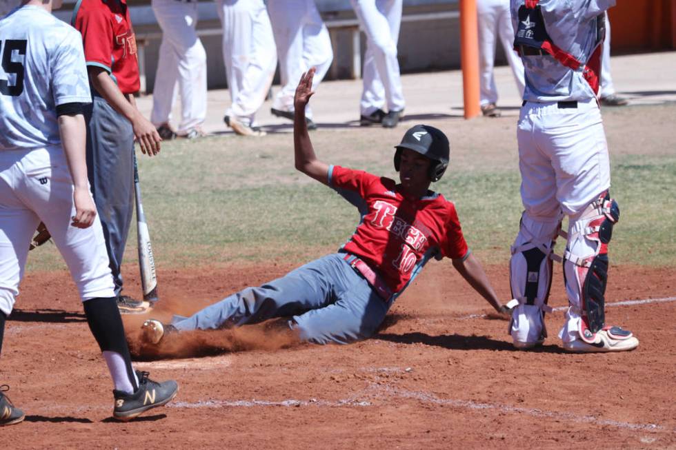 Southeast Career Tech’s Sean Morgan (10) slides home for a run in the fifth inning aga ...