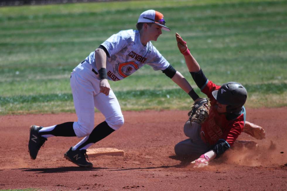 Chaparral’s Cannon Greene (15) tags out Southeast Career Tech’s Drew Cole (15) a ...