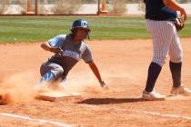 Centennial’s shortstop Kiana Tate (4) slides safely unto third base against North High ...