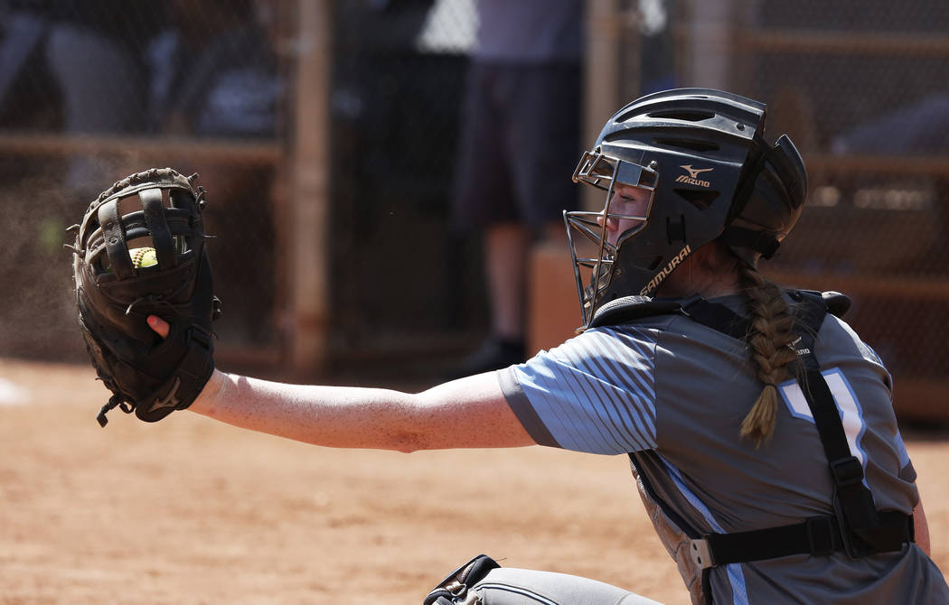 Centennial’s catcher Jillian Bartley (07) catches a throw against North High School du ...