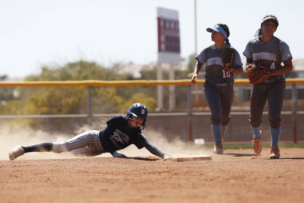 NorthÕs Cynthia Guerrero (28) slides safely into second base against Centennial High Sc ...