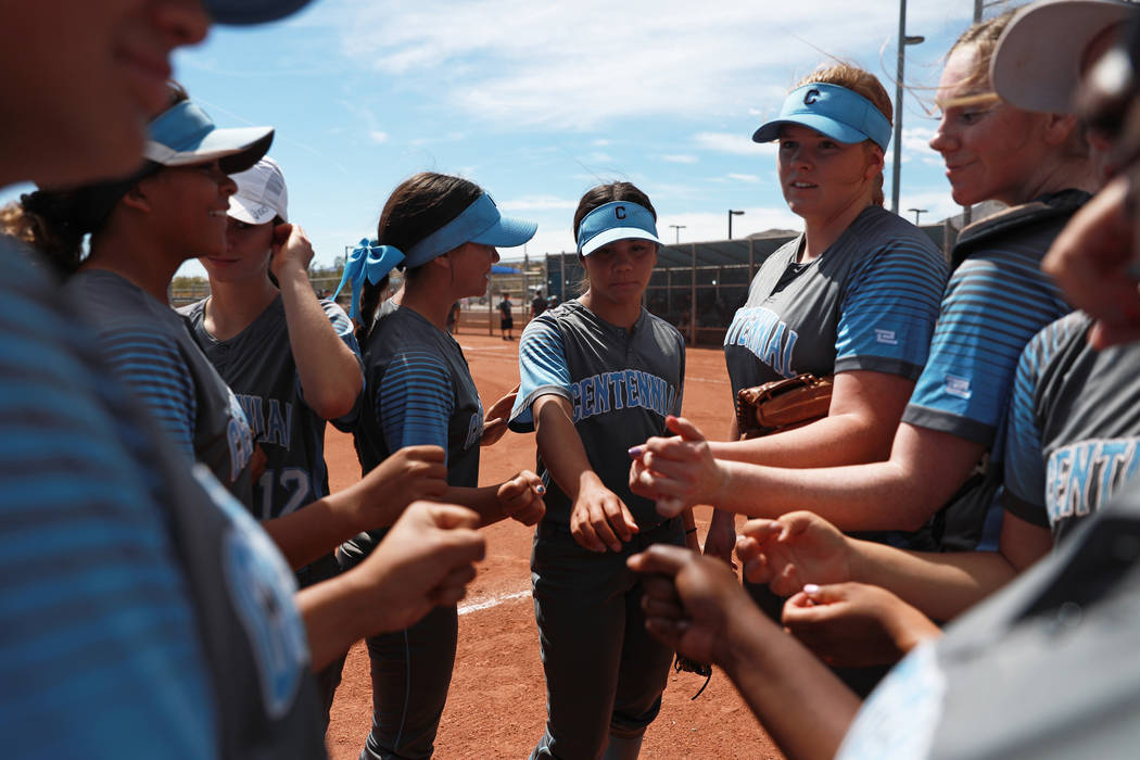 Centennial High School’s softball team gathers for a pep talk during the Spring Jambor ...