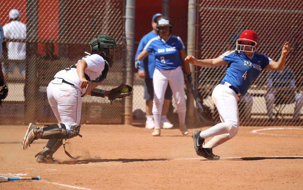 Palo Verde catcher Samantha Wade prepares to tag out San Diego baserunner Isabella Gilbreth ...