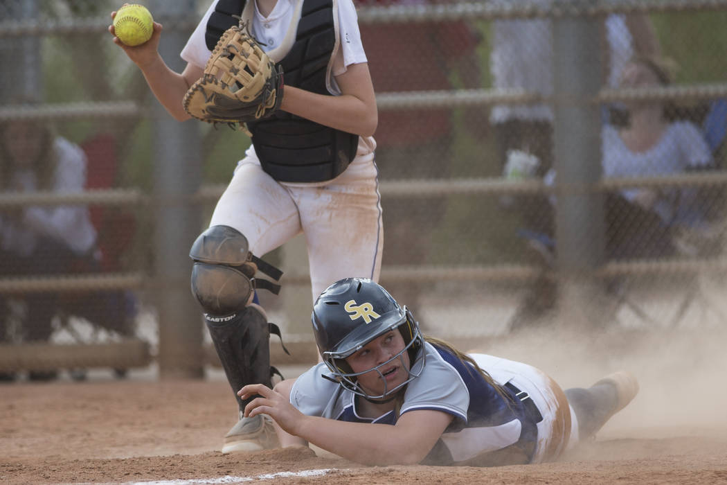 Shadow Ridge’s Tori Nichols (18) slides home late for an out against El Camino Real du ...