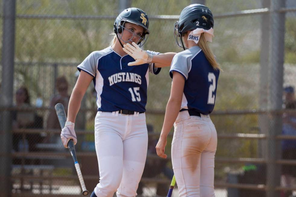 Shadow Ridge’s Tori Nichols (15) Mia Voges celebrates her score with Raelyn Kendall (2 ...