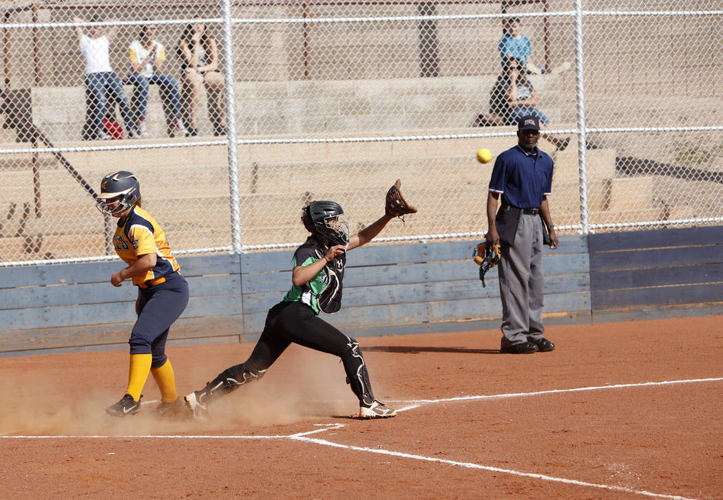 Lily Ofman (11) makes a run as Virgin Valley’s Kaysha Heath (18) tries to catch the ba ...