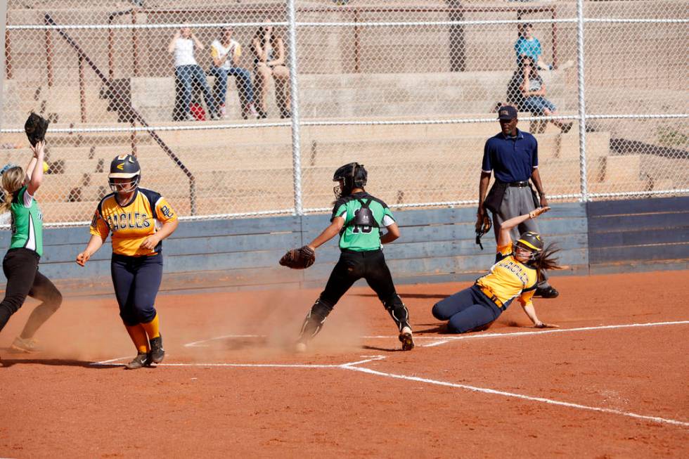 Lily Ofman (11) makes a run as her teammate Rose Mackey (5) lands a run after her as Virgin ...