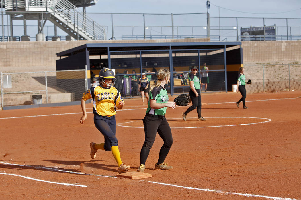 Boulder City High School’s Jordan Moorhead (10) runs to first base safely as Virgin V ...