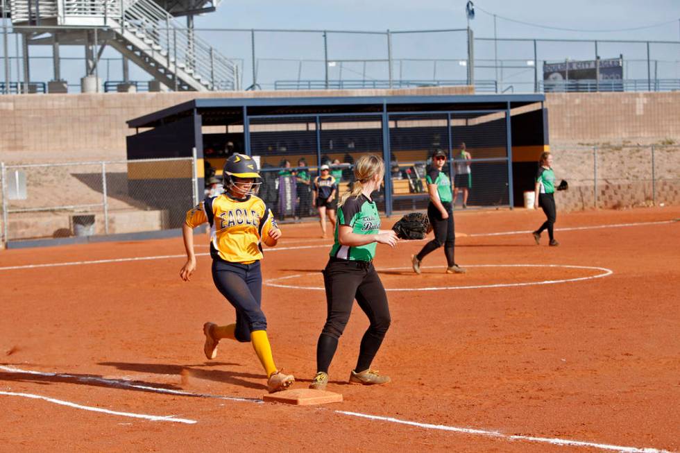 Boulder City High School’s Jordan Moorhead (10) runs to first base safely as Virgin V ...