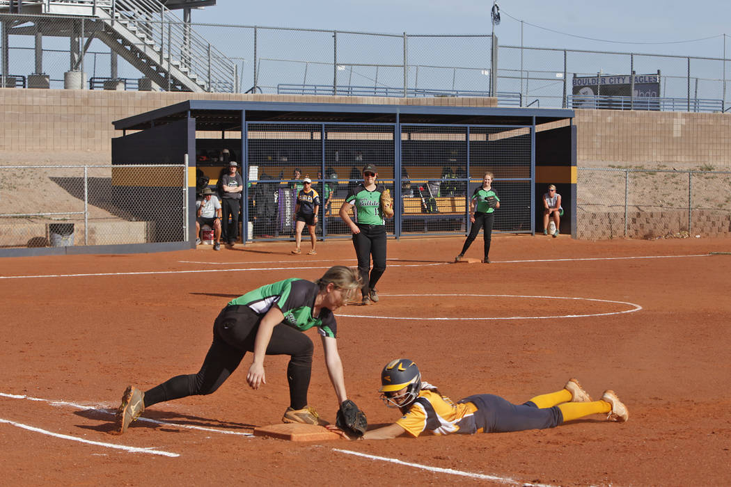 Boulder City High School’s Jordan Moorhead (10) makes it back to first safely as Virgi ...