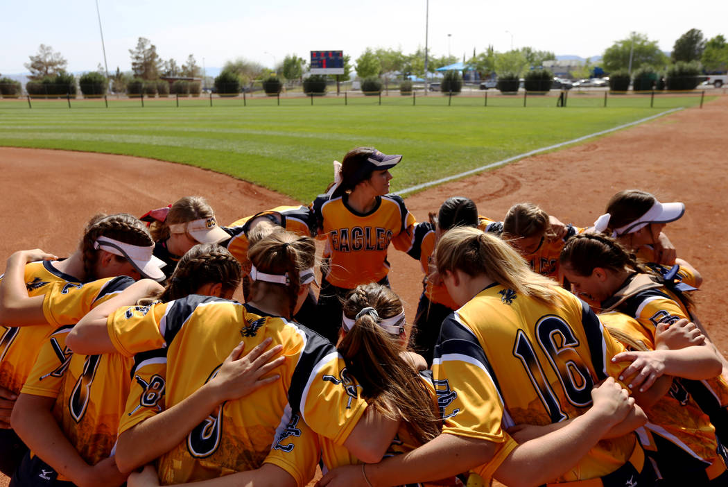 The Boulder City High School softball team huddles before the start of the game against Virg ...