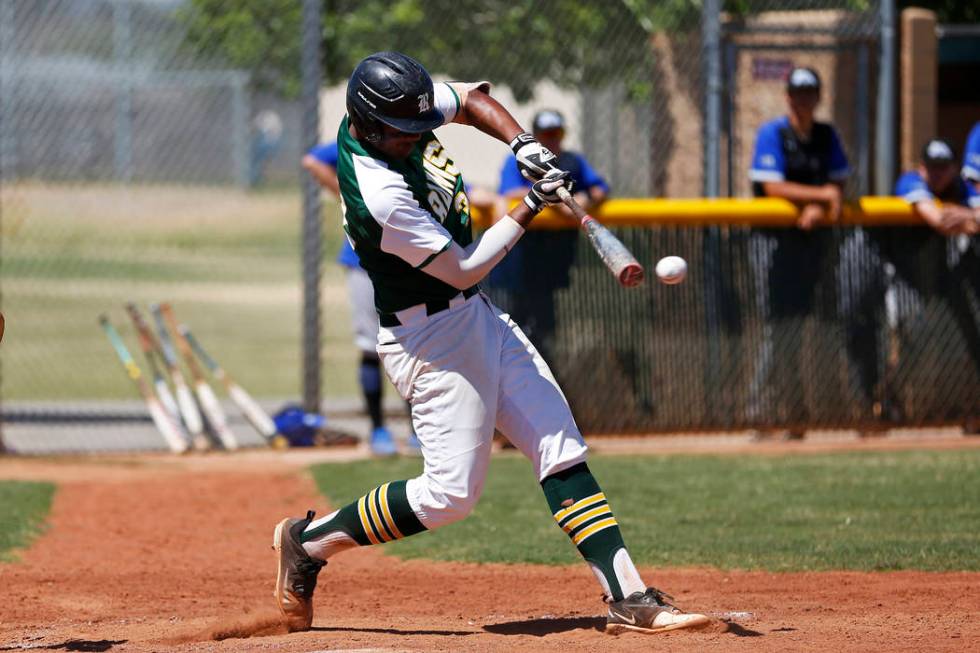 Rancho’s shortstop Edarian Williams (32) swings against Basic at Rancho High School in ...