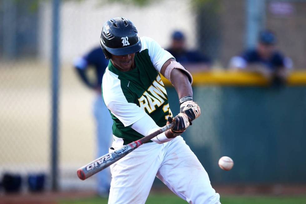 Rancho Rams’ Edarian Williams (32) bats against the Liberty Patriots during a game at ...