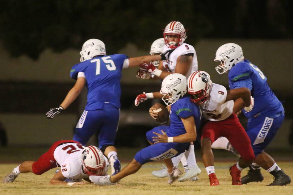 Liberty’s Austin Fiaseu (8) takes down Green Valley quarterback A.J. Barilla during th ...