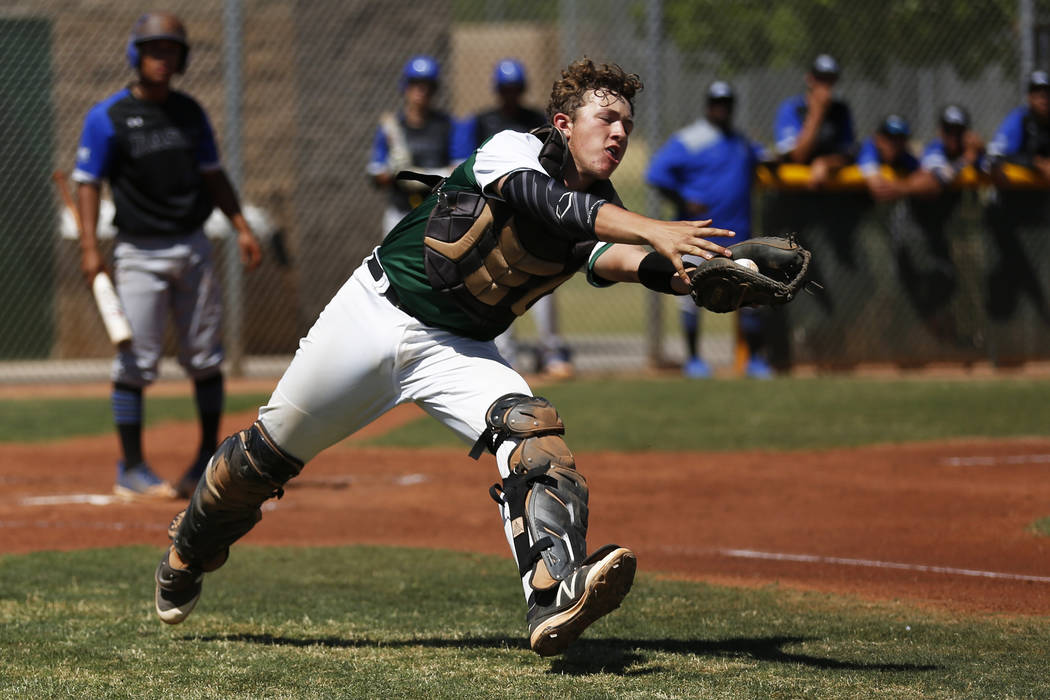 Rancho’s catcher Matthew Baughn (5) catches a pop-up against Basic during the first in ...