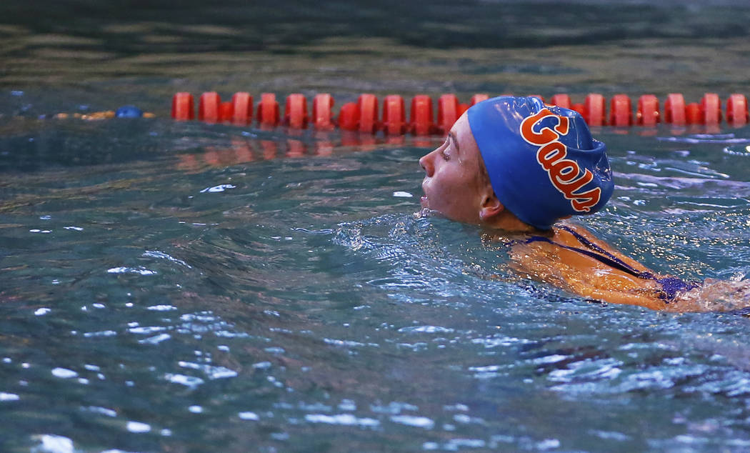 Olivia Gordon, of Bishop Gorman High School, swims back towards the edge of the pool after c ...