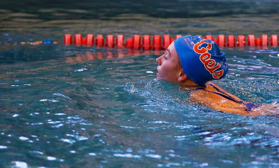 Olivia Gordon, of Bishop Gorman High School, swims back towards the edge of the pool after c ...