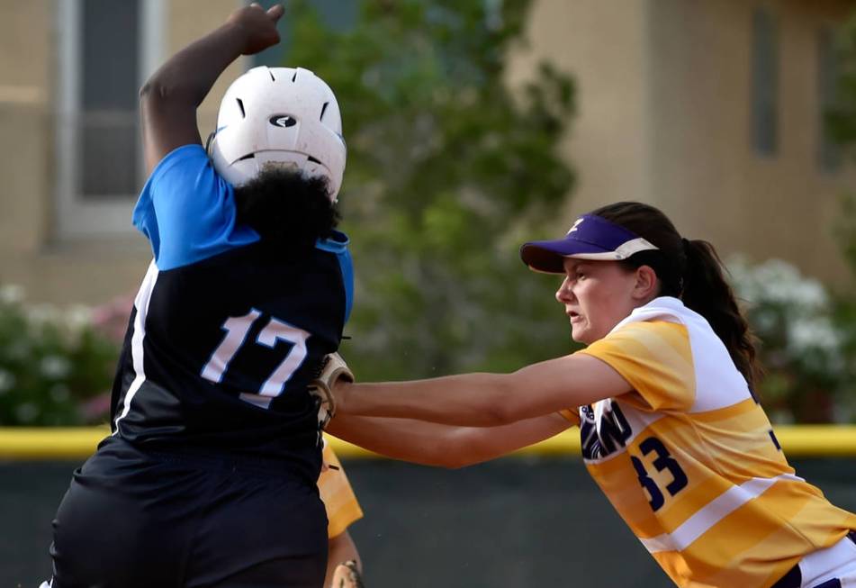 Durango’s Kaitlin Fazendin (33) tags out Centennial’s Amanda Sink during a high ...