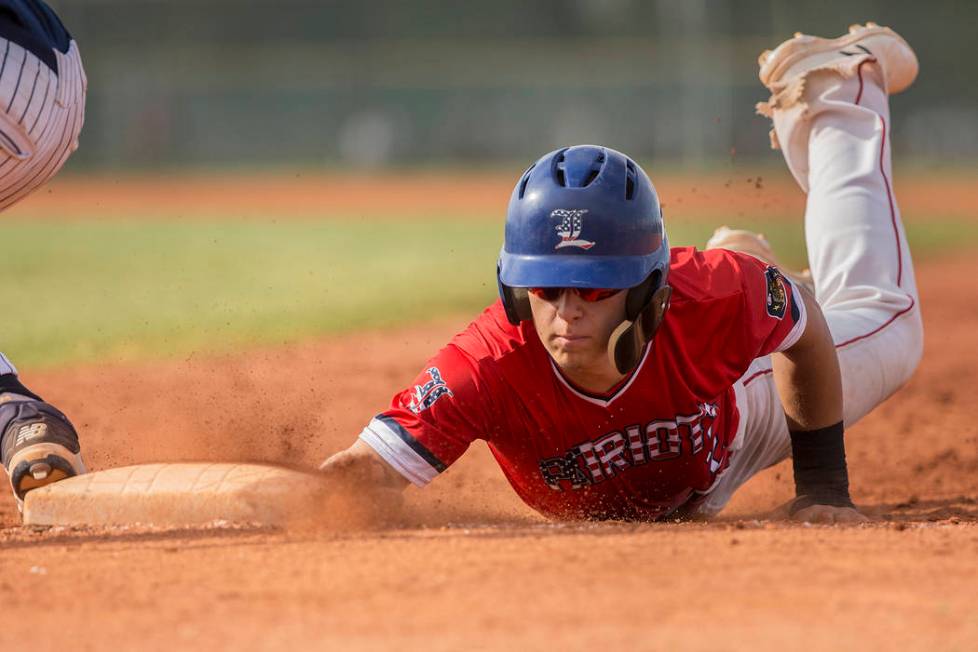 Liberty’s Joseph Rush (2) slides in safely past Coronado’s Boston Mabeus (23) in ...