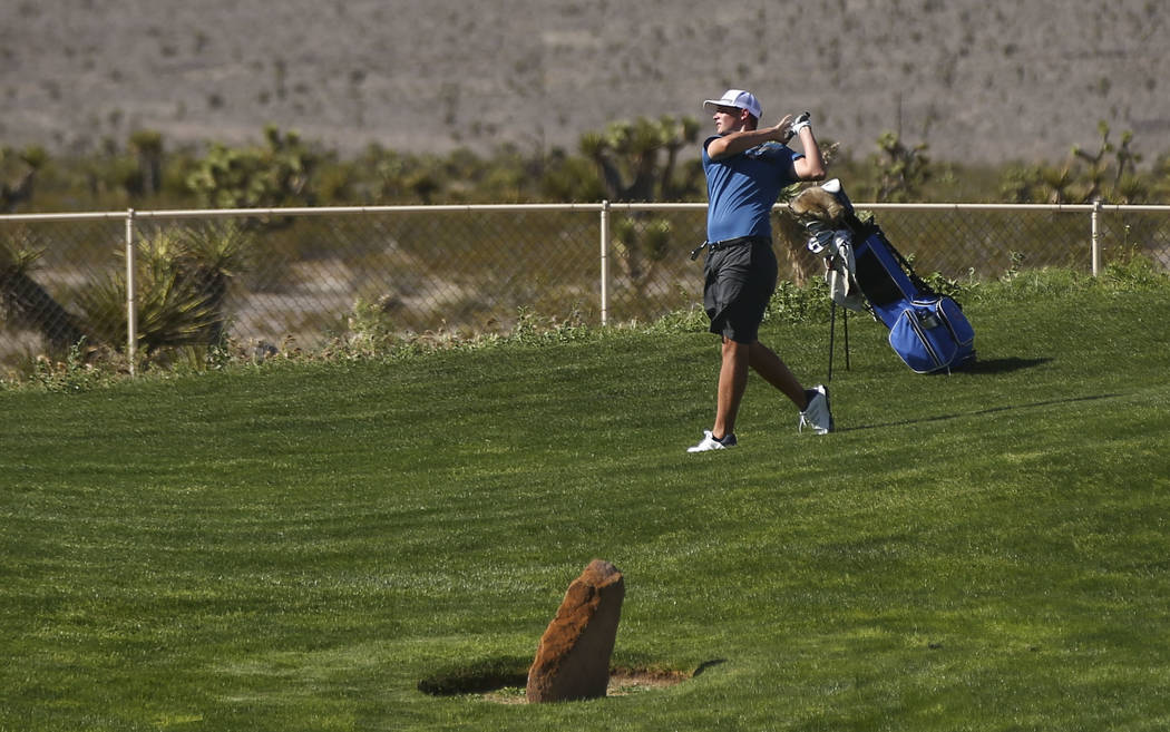 Bishop Gorman’s Mitchell Abbott watches his shot during the Class 4A Sunset Region tou ...