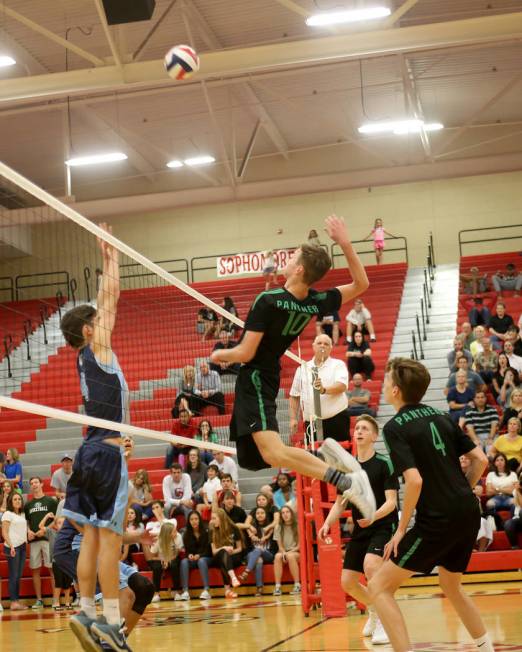 Palo Verde High School’s Jared Brady (10) spikes the ball against Centennial High Scho ...