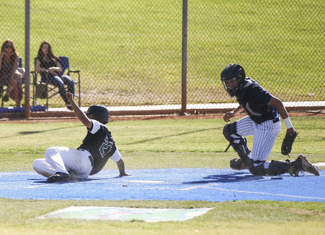 Rancho’s Anthony Guzman (27) scores a run past Coronado’s Braeden Ewing (13) dur ...