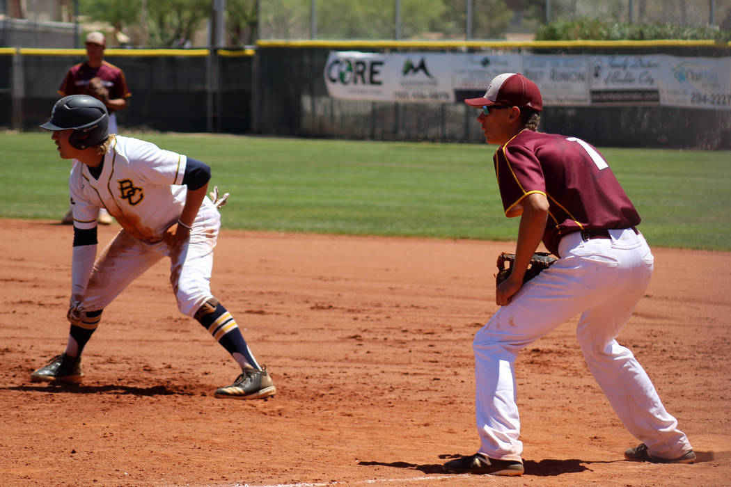 Pahrump Valley’s Garrett Lucas, right, holds Boulder City’s Rhett Armstrong on f ...