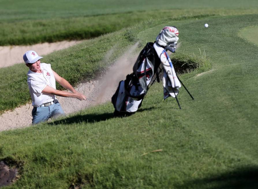 Arbor View’s Cameron Gambini hits out of the sand on the 14th hole at Reflection Bay G ...