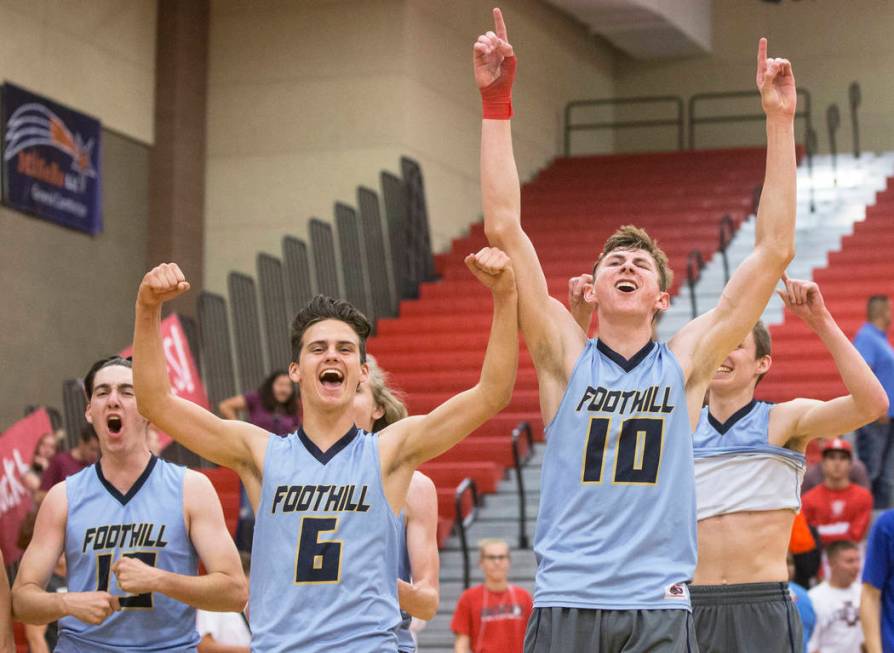 Foothill’s Caleb Stearman (10), Trent Milne (6) and Sawyer Campbell (13) celebrate aft ...