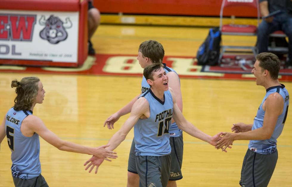 Foothillsjunior Caleb Stearman (10) celebrates with teammates after scoring a point during t ...