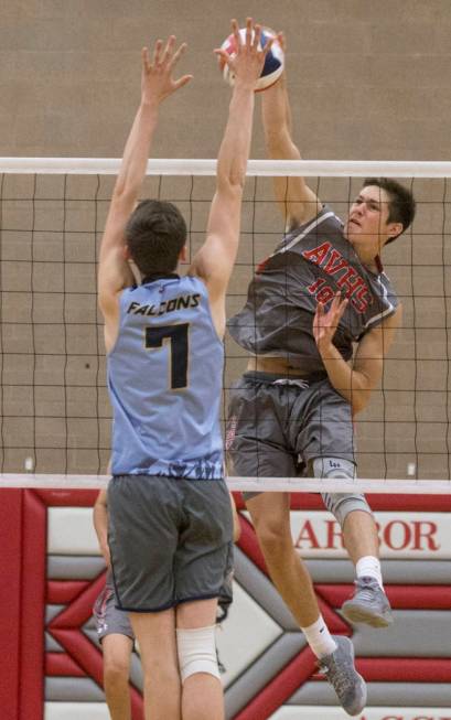 Arbor View junior Logan Bollinger (10) makes a kill past Foothill junior Caden Thomas (7) du ...