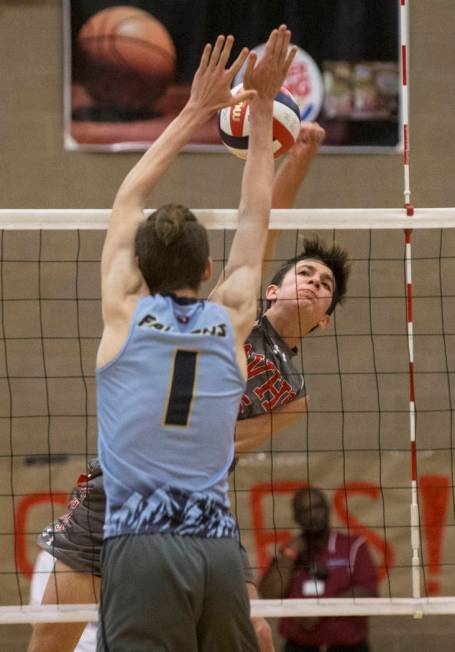 Arbor View junior Gideon Belnap (5) makes a kill past Foothill senior Dylan Meuller (1) duri ...