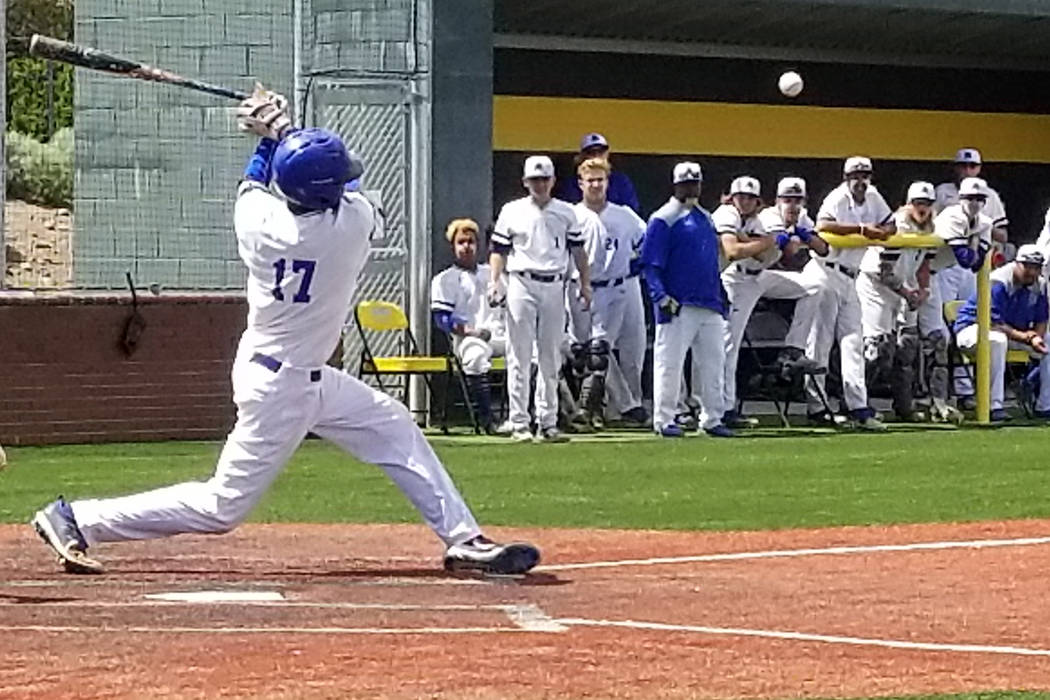 Basic’s Garrett Giles fouls off a pitch against Reno in the Class 4A state baseball to ...