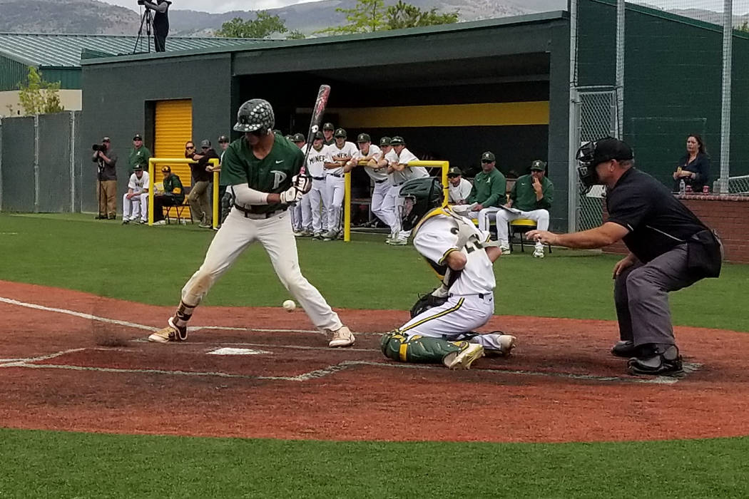 Bishop Manogue catcher Dalton Scolari blocks a pitch as Palo Verde’s Jaret Godman bats ...