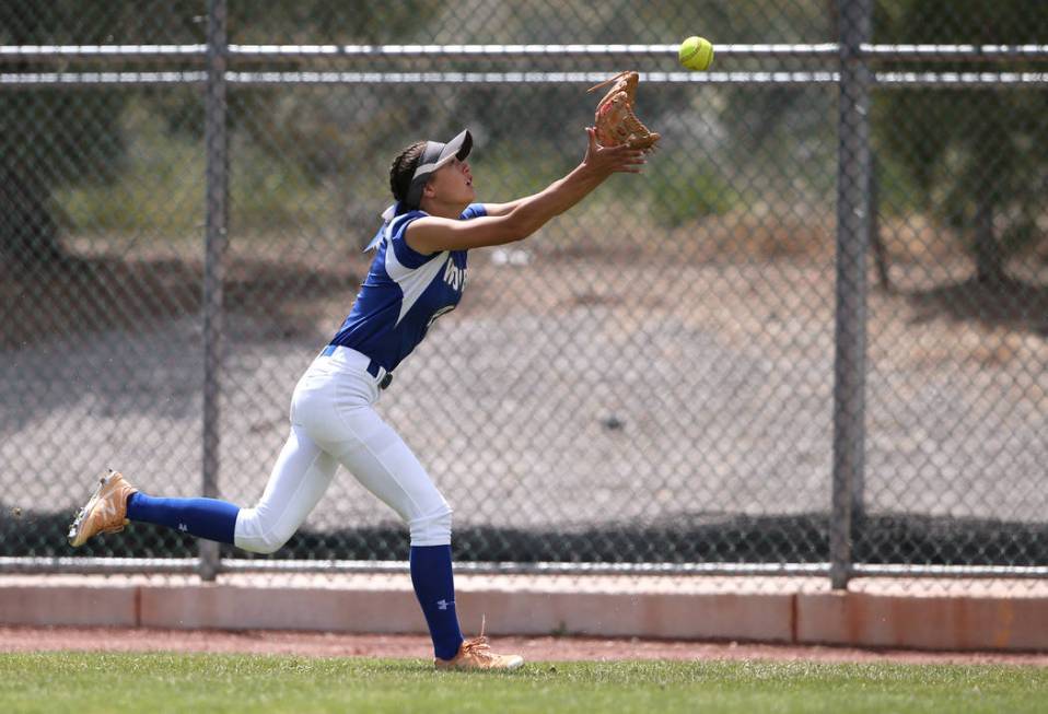 Basic Wolves’ Lauren Koshak makes a catch in right field against the Douglas Tigers in ...