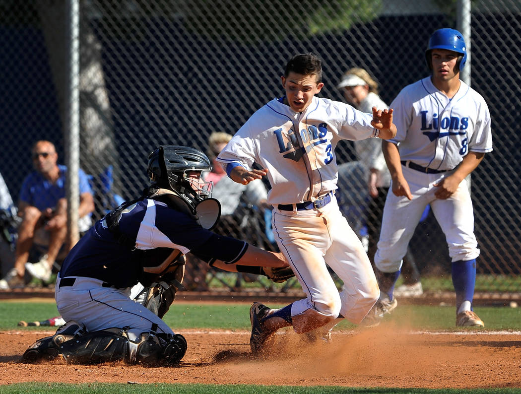 Shadow Ridge catcher Jordan Hand tags out Sierra Vista’s Caeden Marin (3) at home pla ...