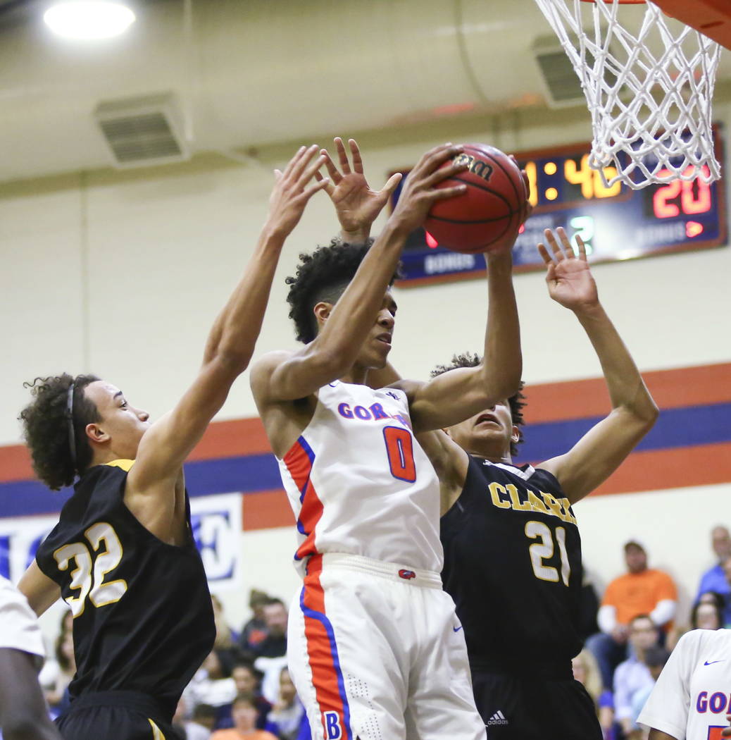 Bishop Gorman’s Isaiah Cottrell (0) gets a rebound over Clark’s Ian Alexander (3 ...