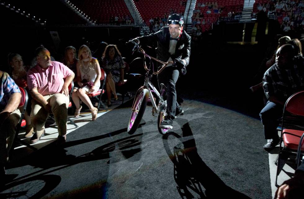 Professional BMX rider and television personality Ricardo Laguna rides to the stage before p ...