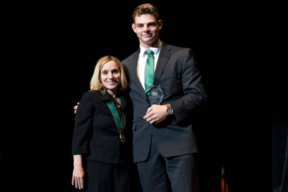 Olympic gold medalist Kerri Strug, left, poses with Jayden Perkins, Virgin Valley High ...