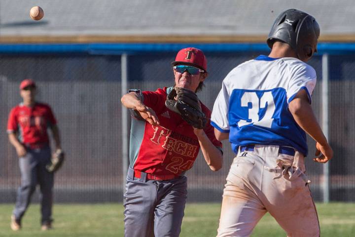 Southeast Career Tech sophomore second baseman Jason Collingbourne (24) turns a double play ...