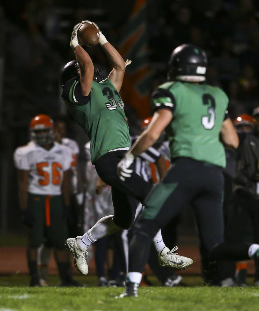 Virgin Valley’s Jayden Perkins (33) catches a pass during the Class 3A state quarterfi ...