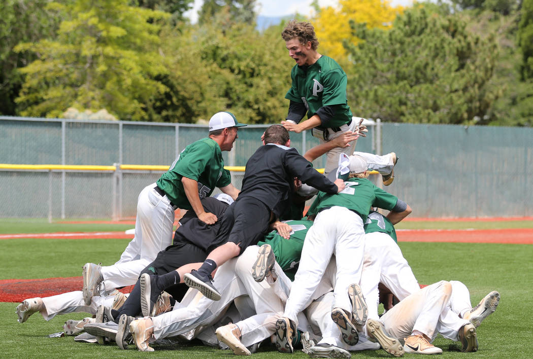 Palo Verde players celebrate their 4-2 win over Basic for the NIAA 4A baseball championship ...