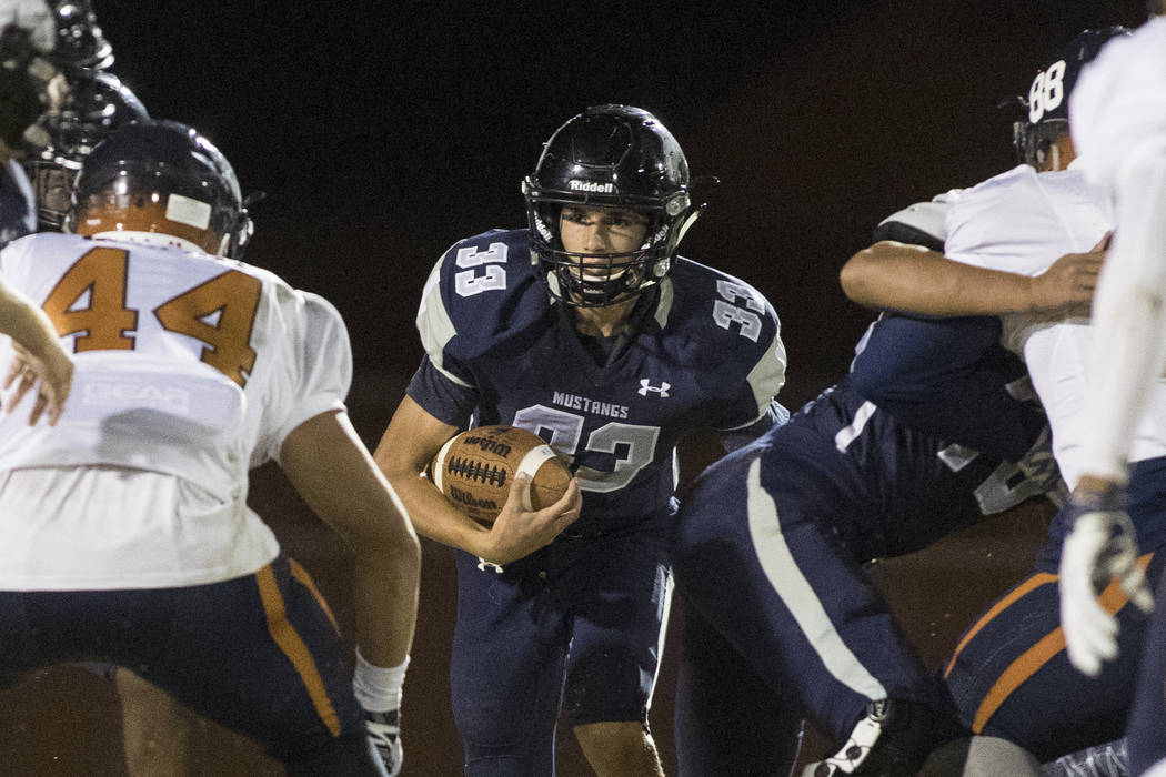 Quarterback Kody Presser (33) runs the ball during a Legacy High School Shadow Ridge High Sc ...