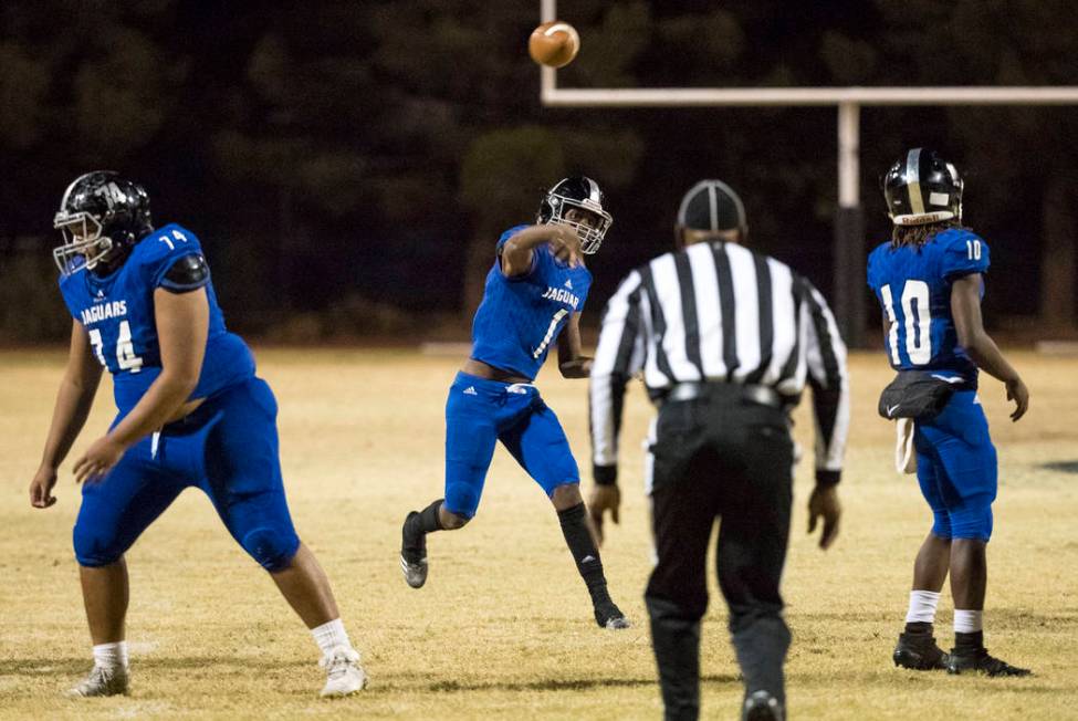 Desert Pines quarterback Tyler Williamson (1) throws for a touchdown during the Class 3A sta ...