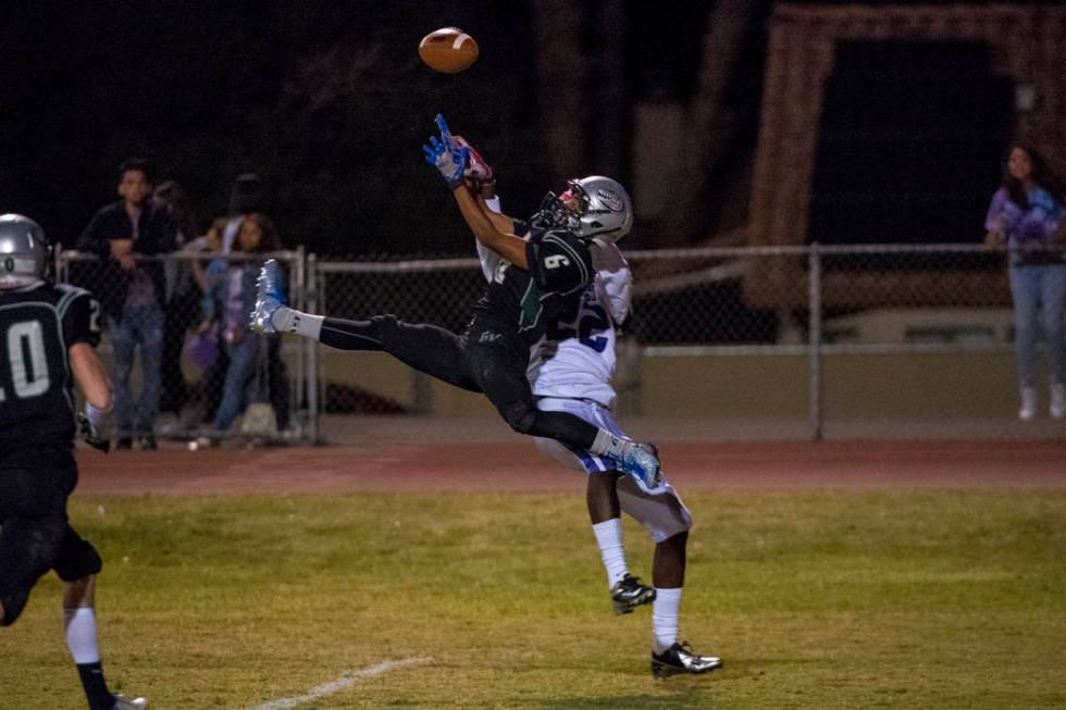 Green Valley defensive back Antoin Kealoha (6) intercepts the ball in front of Silverado rec ...