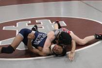 Arbor View 106-pounder Peyton Prussin works on top of Spring Valley’s Bryan Hermida in ...